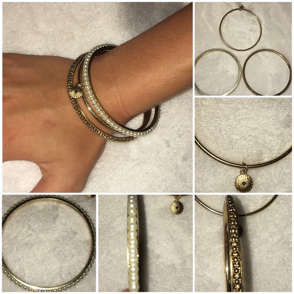 3 gold, metal bracelets with different patterns. - Picture 1 of 1